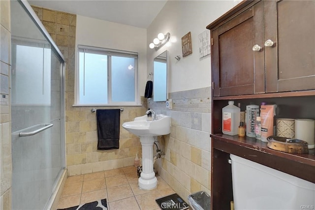13031305 E Kingsley Ave, Pomona, CA 91767 - full bathroom with a stall shower, tile patterned floors, wainscoting, and tile walls
