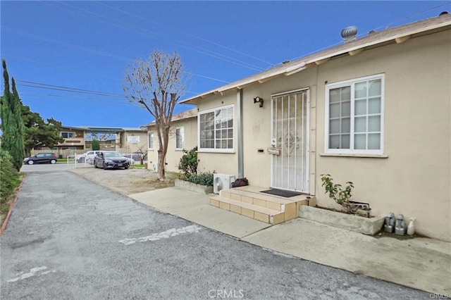 13031305 E Kingsley Ave, Pomona, CA 91767 - property entrance featuring stucco siding