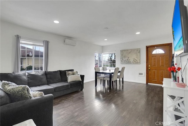 13031305 E Kingsley Ave, Pomona, CA 91767 - living area with dark wood finished floors, an AC wall unit, and a wealth of natural light