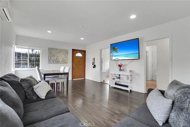 13031305 E Kingsley Ave, Pomona, CA 91767 - living area featuring a wall unit AC, wood finished floors, and recessed lighting
