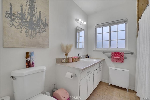 13031305 E Kingsley Ave, Pomona, CA 91767 - bathroom with tile patterned floors, vanity, and toilet