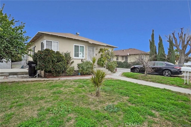 13031305 E Kingsley Ave, Pomona, CA 91767 - view of front of home with a front lawn and stucco siding