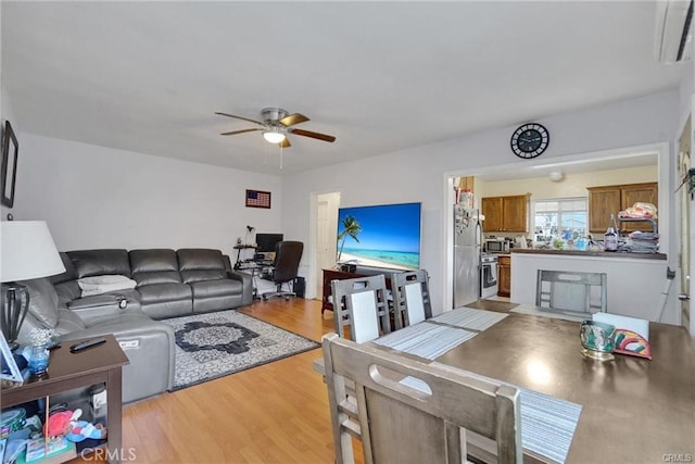 13031305 E Kingsley Ave, Pomona, CA 91767 - living area with light wood-type flooring and ceiling fan