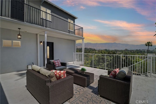 334 Anita Dr, Pasadena, CA 91105 - patio terrace at dusk featuring a balcony, an outdoor living space, and a mountain view