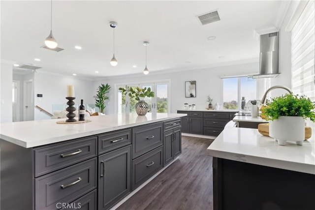 334 Anita Dr, Pasadena, CA 91105 - kitchen featuring healthy amount of natural light, light countertops, crown molding, range hood, and a center island