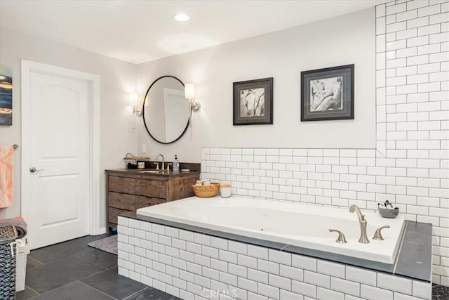full bathroom featuring tile patterned flooring, recessed lighting, vanity, and a garden tub