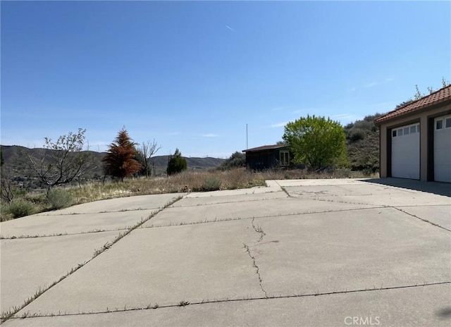 view of road with driveway