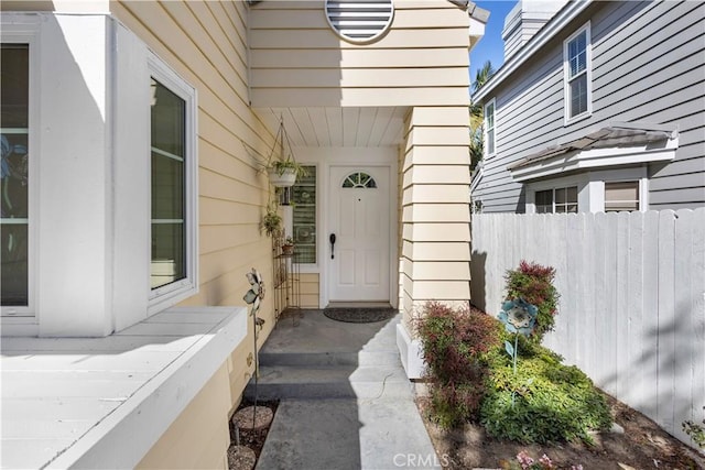 doorway to property with fence