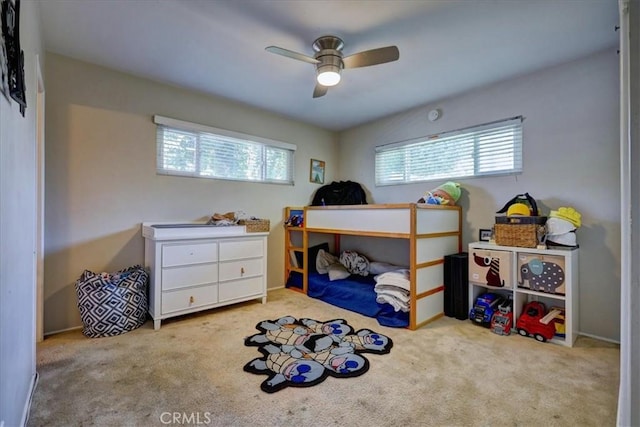 carpeted bedroom featuring a ceiling fan