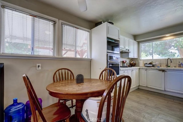 dining space featuring light wood-type flooring