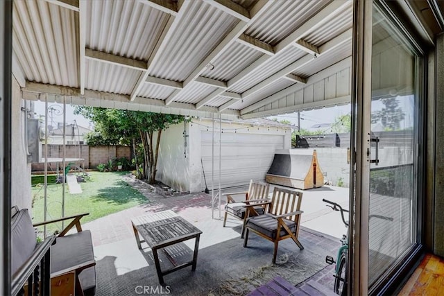 view of patio with a trampoline and a fenced backyard