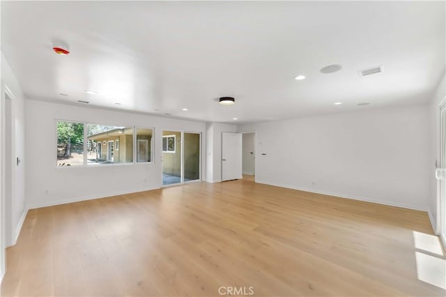 950 S Spring Meadow Dr, West Covina, CA 91791 - unfurnished living room with light wood finished floors, baseboards, and recessed lighting