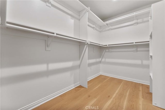 950 S Spring Meadow Dr, West Covina, CA 91791 - walk in closet featuring light wood-type flooring