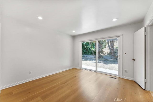 950 S Spring Meadow Dr, West Covina, CA 91791 - empty room with light wood-type flooring, recessed lighting, and baseboards