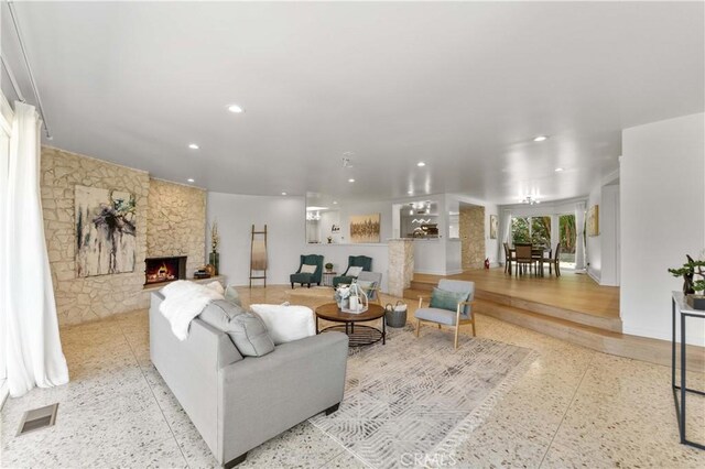 950 S Spring Meadow Dr, West Covina, CA 91791 - living area featuring a stone fireplace and recessed lighting