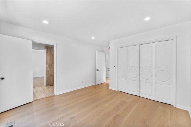 950 S Spring Meadow Dr, West Covina, CA 91791 - unfurnished bedroom featuring light wood-type flooring, recessed lighting, baseboards, and a closet