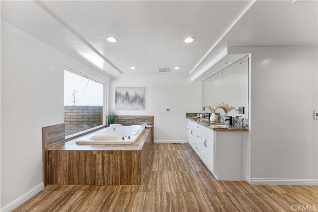 950 S Spring Meadow Dr, West Covina, CA 91791 - full bath featuring vanity, a bath, wood finished floors, baseboards, and recessed lighting