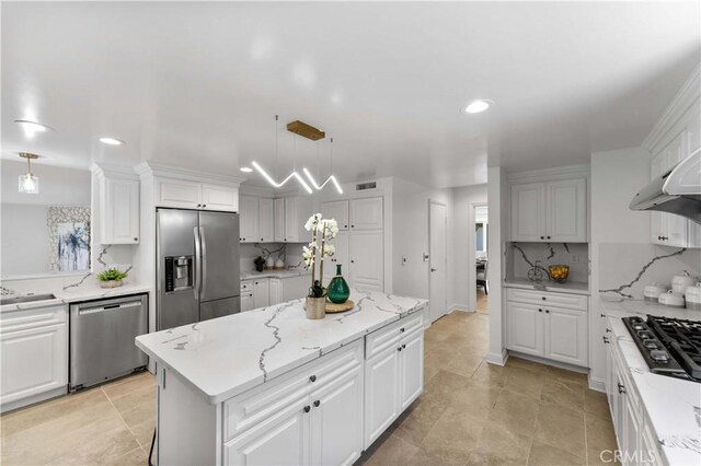 950 S Spring Meadow Dr, West Covina, CA 91791 - kitchen with stainless steel appliances, a kitchen island, recessed lighting, white cabinetry, and backsplash