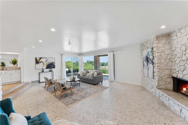 950 S Spring Meadow Dr, West Covina, CA 91791 - living area featuring baseboards, a stone fireplace, and recessed lighting
