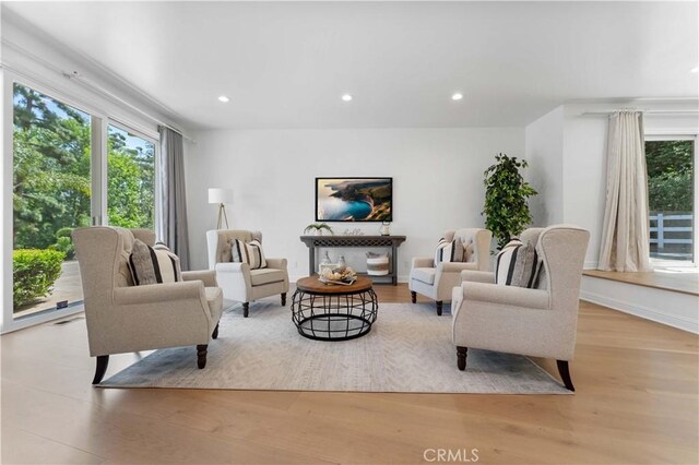 950 S Spring Meadow Dr, West Covina, CA 91791 - living area featuring healthy amount of natural light, wood finished floors, and recessed lighting