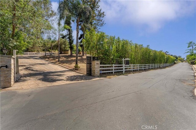 950 S Spring Meadow Dr, West Covina, CA 91791 - view of asphalt road with a gate