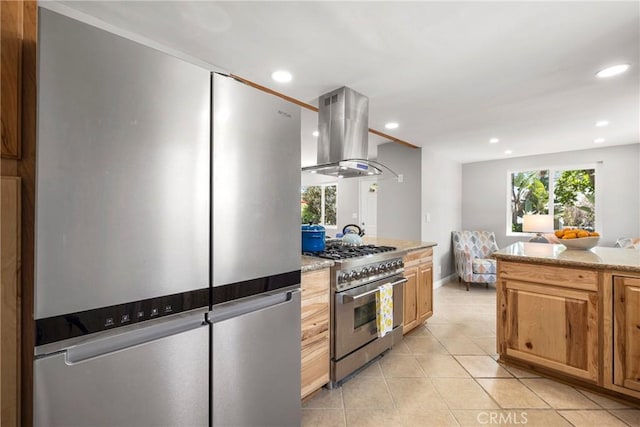 kitchen featuring light tile patterned flooring, island range hood, stainless steel appliances, and recessed lighting