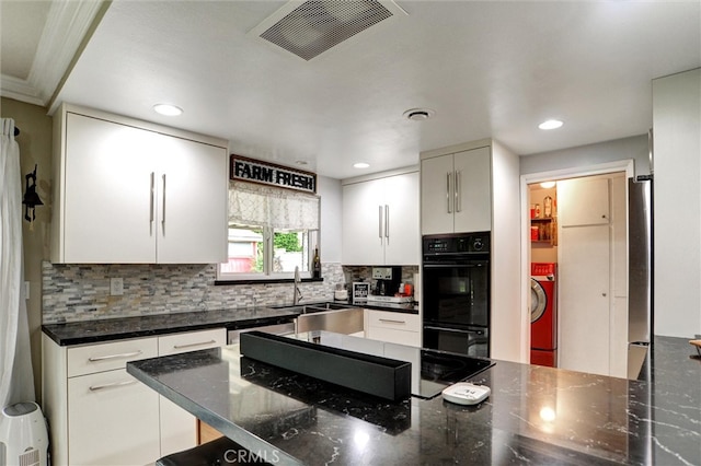 kitchen featuring visible vents, white cabinetry, decorative backsplash, and black appliances