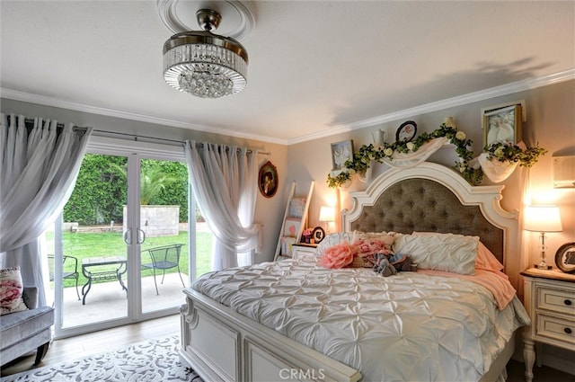 bedroom featuring light wood-type flooring, access to exterior, and ornamental molding