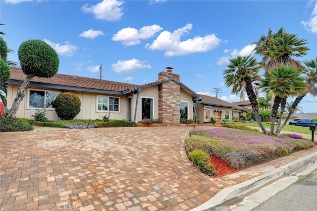 ranch-style house with a chimney