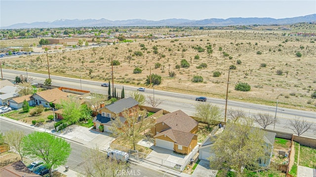 birds eye view of property featuring a mountain view