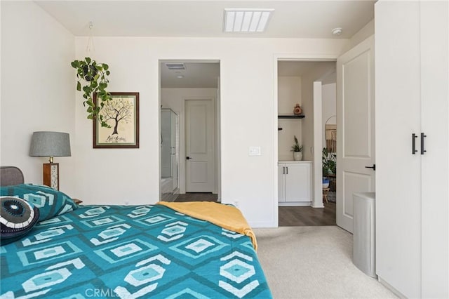 carpeted bedroom with visible vents