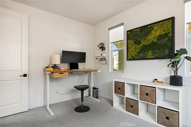 carpeted office with baseboards