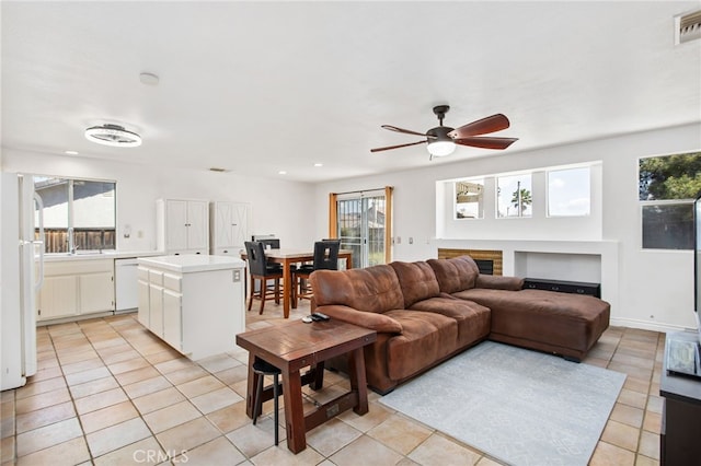 27304 Mystical Springs Dr, Corona, CA 92883 - living room featuring light tile patterned floors, ceiling fan, and recessed lighting