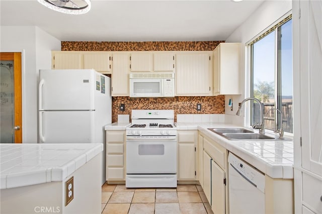 27304 Mystical Springs Dr, Corona, CA 92883 - kitchen with white appliances, tile countertops, a sink, decorative backsplash, and cream cabinetry