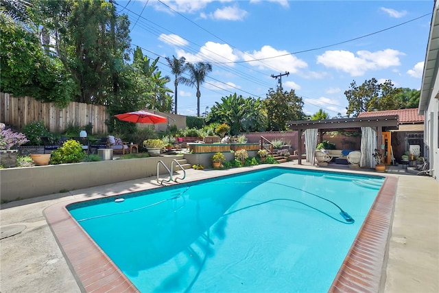 view of pool with a fenced backyard and a fenced in pool