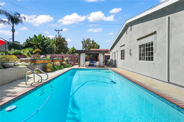 view of pool featuring a fenced in pool, a patio area, and a fenced backyard