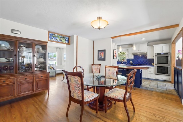 dining room with wood finished floors