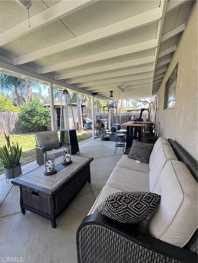 view of patio featuring outdoor lounge area and a fenced backyard