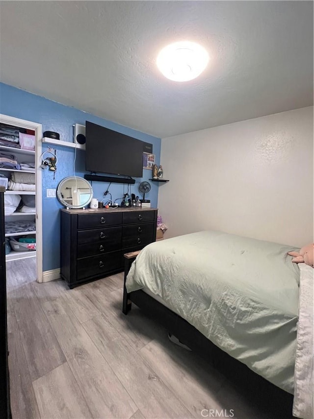 bedroom featuring light wood finished floors