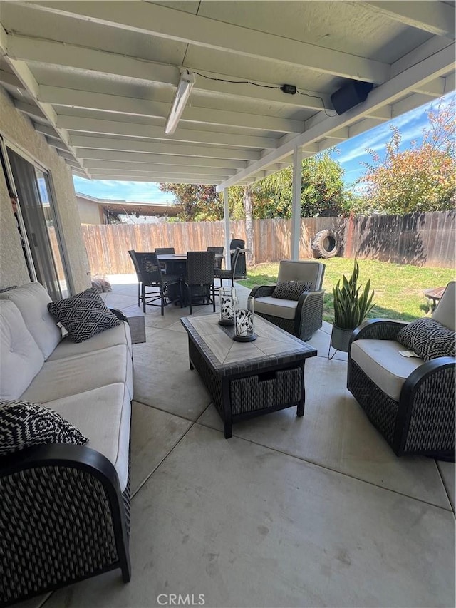 view of patio / terrace with outdoor dining space, outdoor lounge area, and a fenced backyard