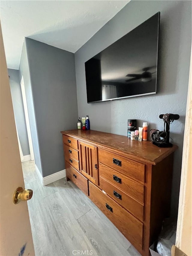details featuring baseboards and wood finished floors