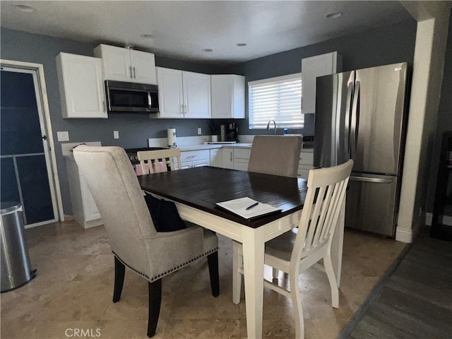 dining space with recessed lighting