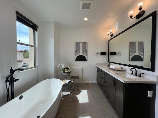 772 Francesca Dr, Walnut, CA 91789 - bathroom featuring double vanity, tile patterned floors, a soaking tub, and baseboards
