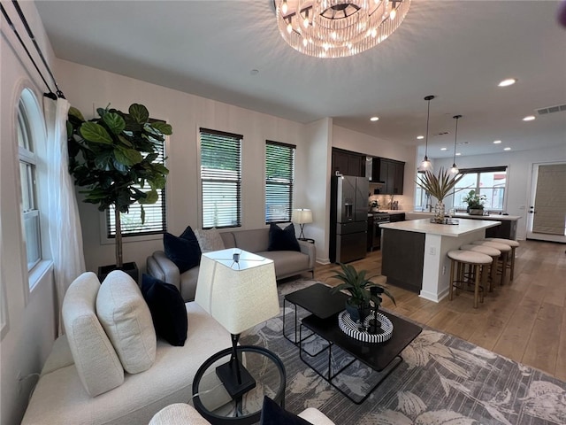 772 Francesca Dr, Walnut, CA 91789 - living area with light wood finished floors, a chandelier, and recessed lighting