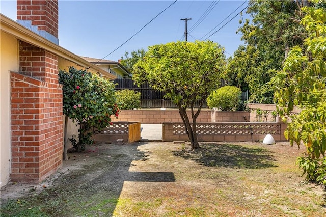 view of yard featuring a patio area and fence