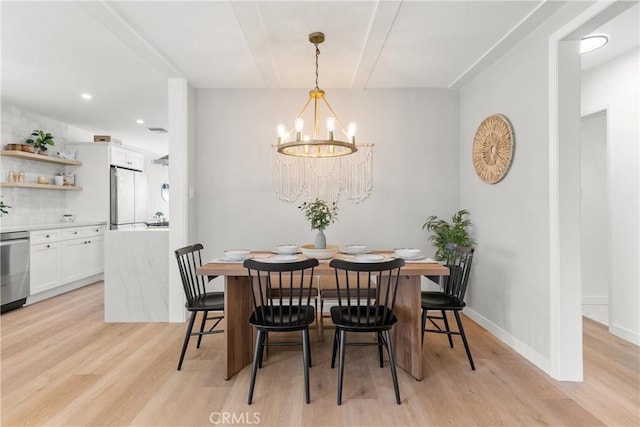 dining room with light wood-style floors, a notable chandelier, baseboards, and recessed lighting