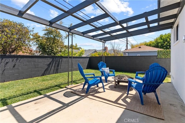 view of patio with a fenced backyard, a pergola, and a fire pit