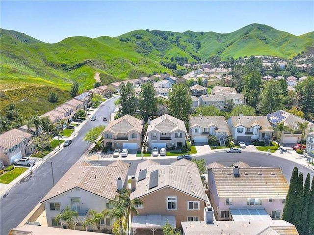 drone / aerial view featuring a mountain view and a residential view