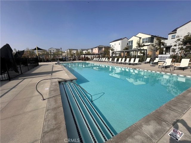 4450 S Bryant Paseo, Ontario, CA 91762 - pool featuring a residential view, a patio, and fence