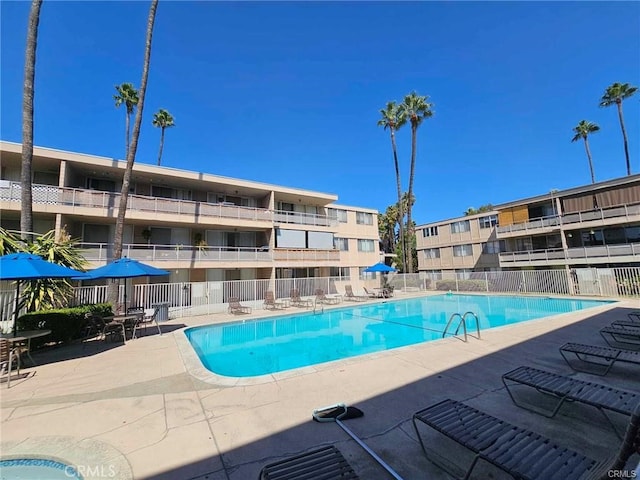 6979 Palm Ct Unit 126H, Riverside, CA 92506 - pool featuring a patio and fence